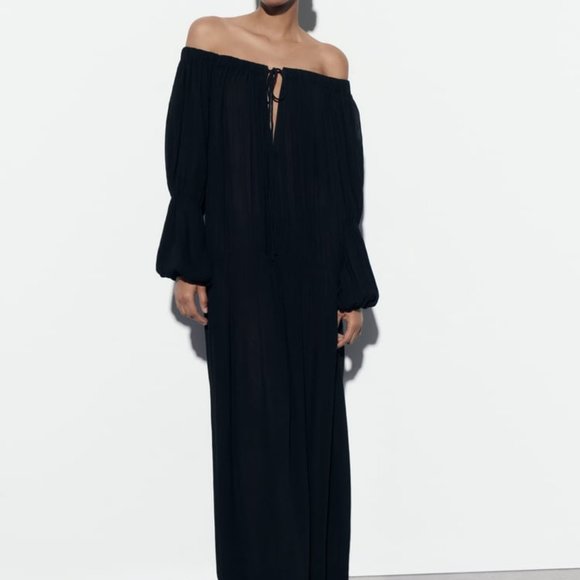 Pantalon palazzo plissé noir avec motif fleuris Pantalon palazzo plissé noir avec motif fleuris